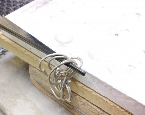 Judy Larson's Making Chain with Wubbers and Wire - , Contemporary Wire Jewelry, Making Chain, Chain Making , Butane Torch, Soldering, Solder, Continue to connect the links until the desired length is achieved.